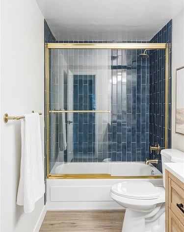 Modern cleaned bathroom with gold accents in Denver home by SparkEaseCleaning