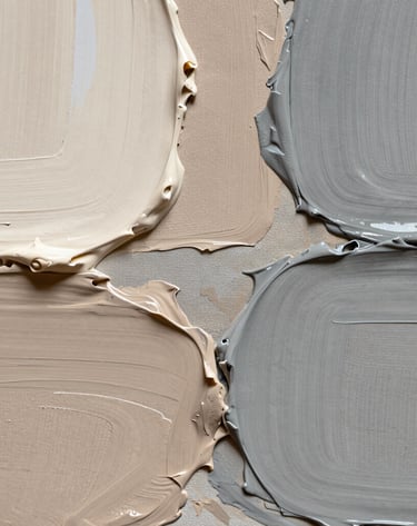 An abstract macro photograph of oil paint textures on a canvas, showing thick layers of cream, taupe, and warm grey. Soft, diffused lighting highlights the physical ridges of the medium. Professional and artistic style. International / Western setting.