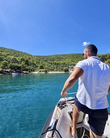 A skipper anchoring a speedboat at Krusica Bay, Solta in Croatia during a private boat tour from Split