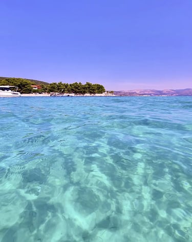 Stunning turquoise and crystal-clear sea at Blue Lagoon, Croatia on a private boat tour from Split