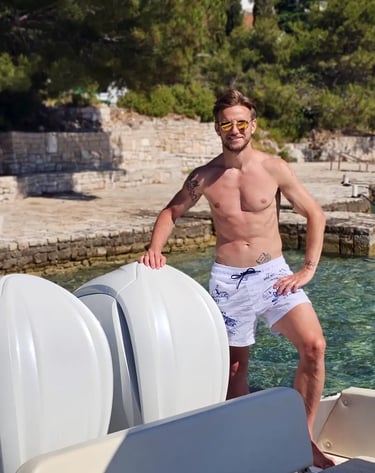 Ivan Rakitic posing shirtless on a speedboat during a private boat tour from Split
