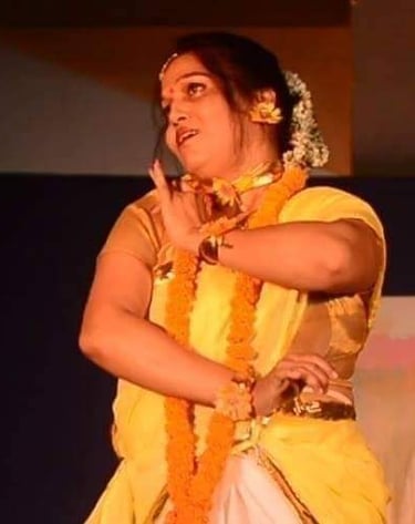 Mrs. Chaitali Biswas guiding students through a classical dance pose in a lively rehearsal