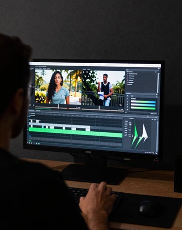Over-the-shoulder shot of a video editor working in a dark, minimalist studio. The screen shows a high-conversion marketing video being color-graded. Lighting is focused, cinematic, using white and neon green highlights. South American / Brazilian setting.