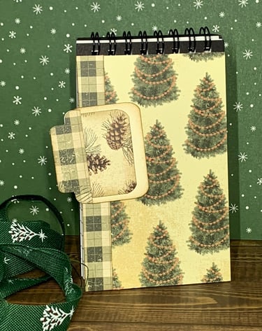 Christmas tree themed covered spiral covered notebook and hidden paper clipan