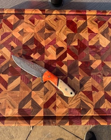 Large end grain chaos board made with cherry, maple, white oak, bourbon barrel, and purple heart.