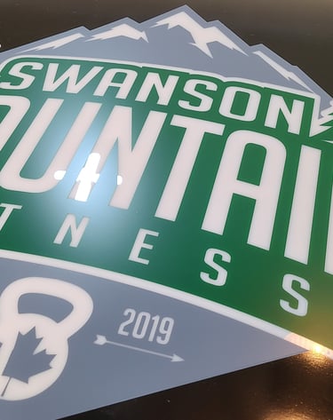 "A collection of printed signs in various colors and sizes, displaying messages and graphics for an