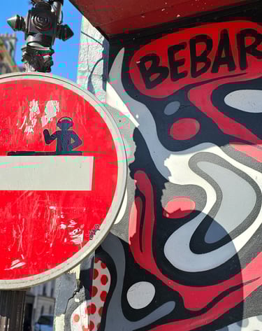 a red and white sign with a no entry sign