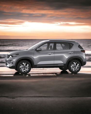a silver kia sonet parked on the beach