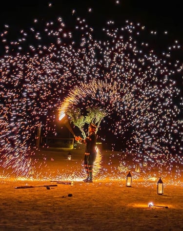 a man standing in front of a firework