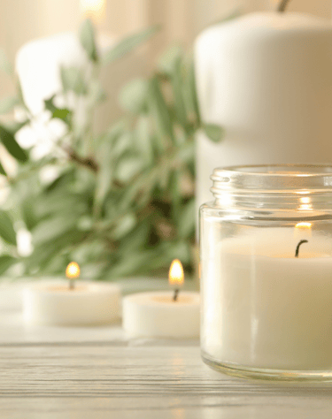 a candle with candles and candles on a table