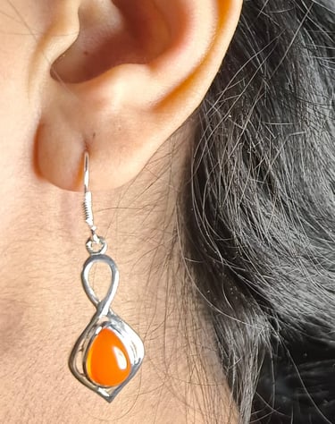 a woman's earrings and earrings