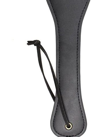 a faux leather paddle for bdsm play