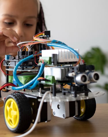 a girl is playing with a robot