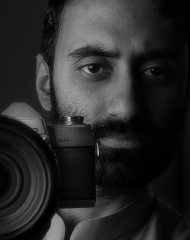 a man with a camera and a camera