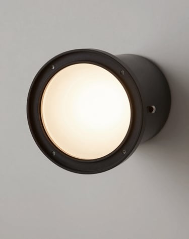 Close-up of a 3D rendered lighting fixture in a minimalist interior. Focus on the play of light and shadow, sophisticated design, soft white background.