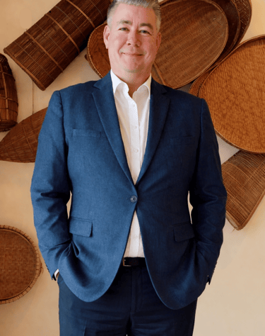 Portrait of Lance, founder of MagVin Labs, standing confidently in a professional setting