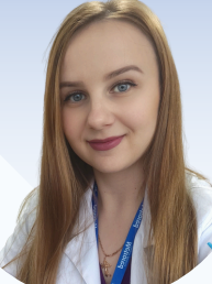 a woman in a lab coat and a blue lanyard lanyard lanyard lan