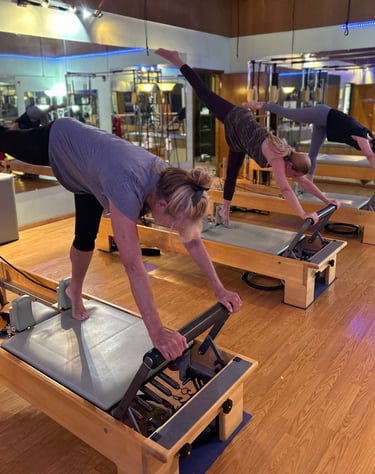 three women doing pilates