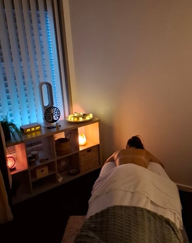 a person laying on a bed in a room