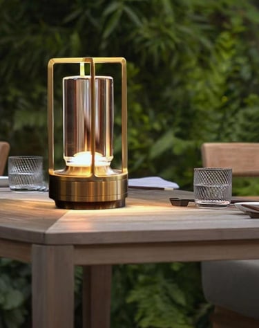 glowing lantern on table in backyard.
