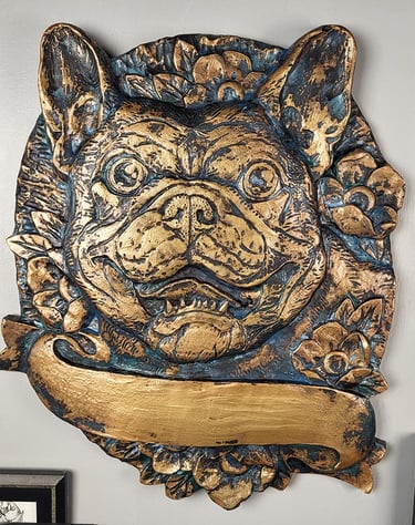 Custom bronze plaque of a French Bullldog with a banner and flowers