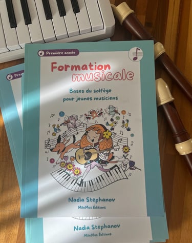a music book with a keyboard and a recorder