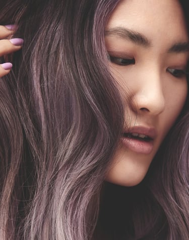 a woman with long hair and purple hair