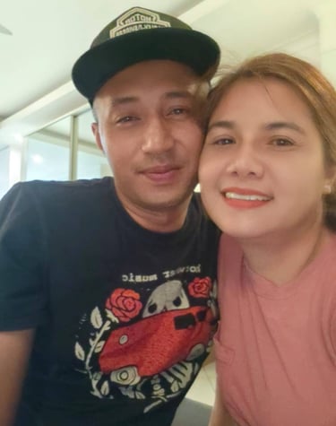 couple looking at camera cheek to cheek