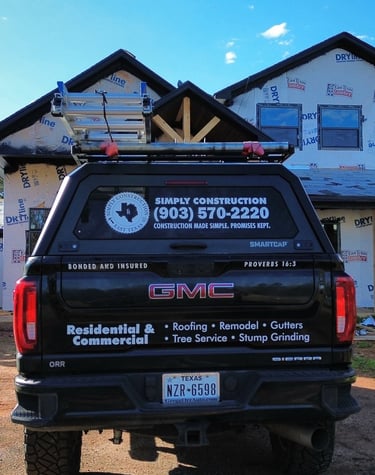 Work truck at jobsite for a roof installation on brand new home construction in Tyler, TX