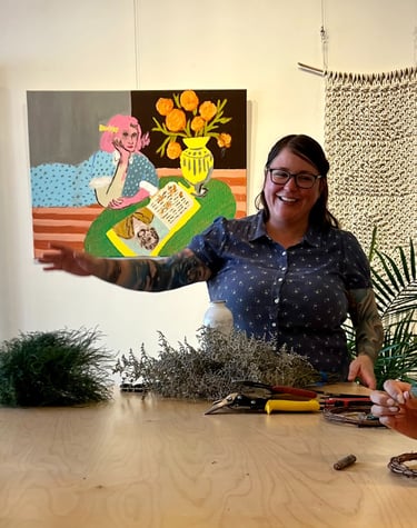 a woman is standing in front of a table with wreath making materials on it