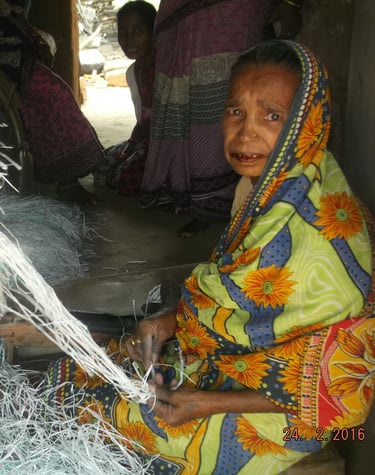 a woman in a brightly colored dress sitting on a chair