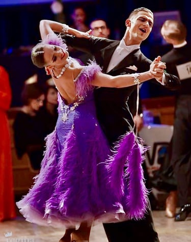 a man and woman dancing ballroom