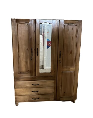 a wooden armoire with a mirror and a mirror