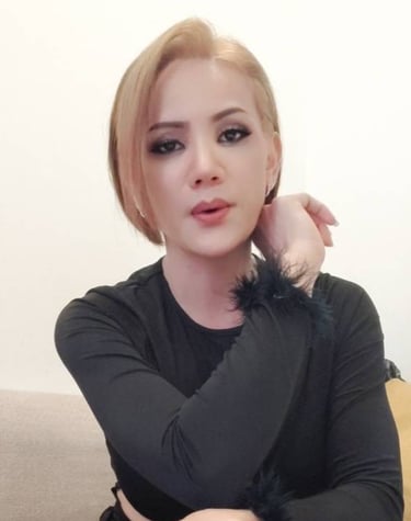 ladyboy with short blonde hair and black top ready for outcall massage