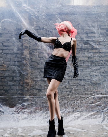 a woman in a black dress and black boots