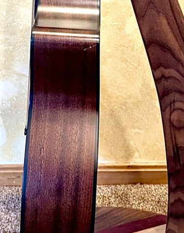 Handcrafted wood, mobile guitar stand crafted from Black Walnut, Maple, and Purple Heart. 