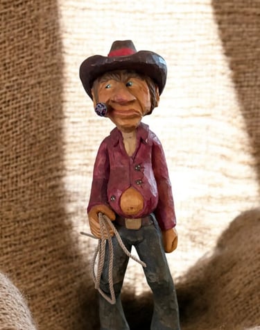 Cow Poke carved by Jim Oehmke