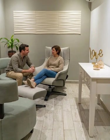 a man and woman sitting in a room