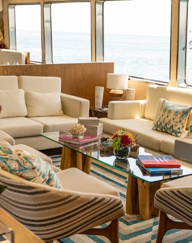 Refined yacht interior lounge with panoramic sea views, showcasing comfort and design
