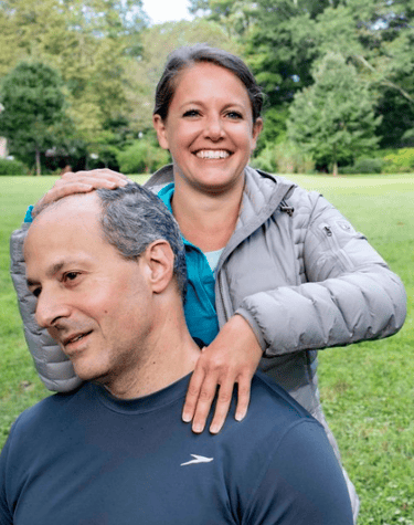 a man and woman smiling and posing for a picture
