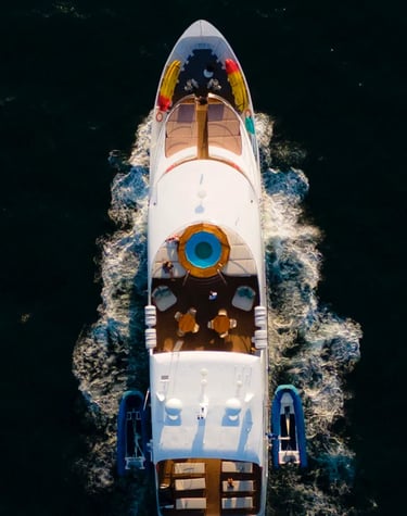 Luxury expedition yacht navigating pristine ocean waters, offering boutique cruise experiences