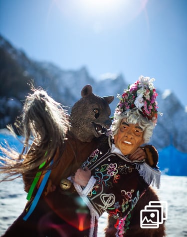 a man in a costume with a bear during carnival in winter