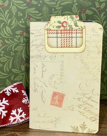 Christmas-themed letter (postal) covered notebook and hidden paper clip