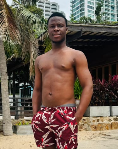 man wearing red and white shorts with his hands in his pockets