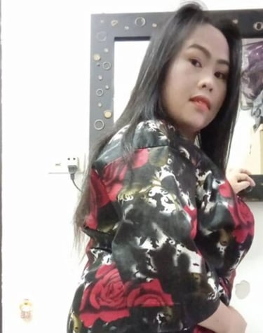 Side angle view of lady wearing long sleeve patterned dress