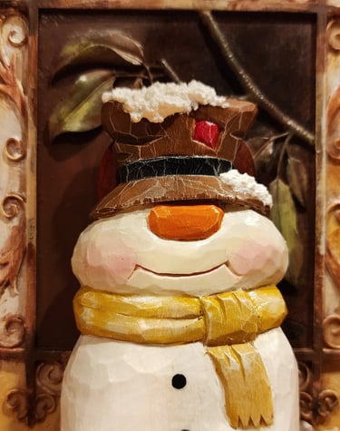 hand carved snowman in basswood with top hat and scarf, carved by James Smith