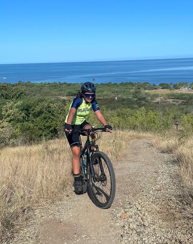 a person riding a bike on a dirt road