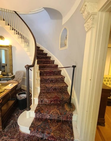 Huntsville, AL - Inside the mansion is a beautiful curved staircase at Burritt on the Mountain