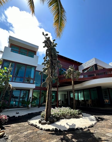 Exterior view of Villa Escalesia Galápagos, a contemporary oceanfront boutique hotel surrounded by n