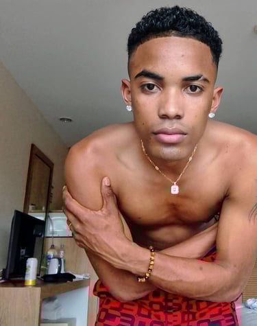 Man wearing red boxer shorts bending forward with his arms crossed